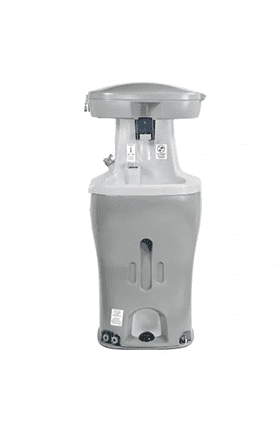 A white hand washer sitting on top of a counter.